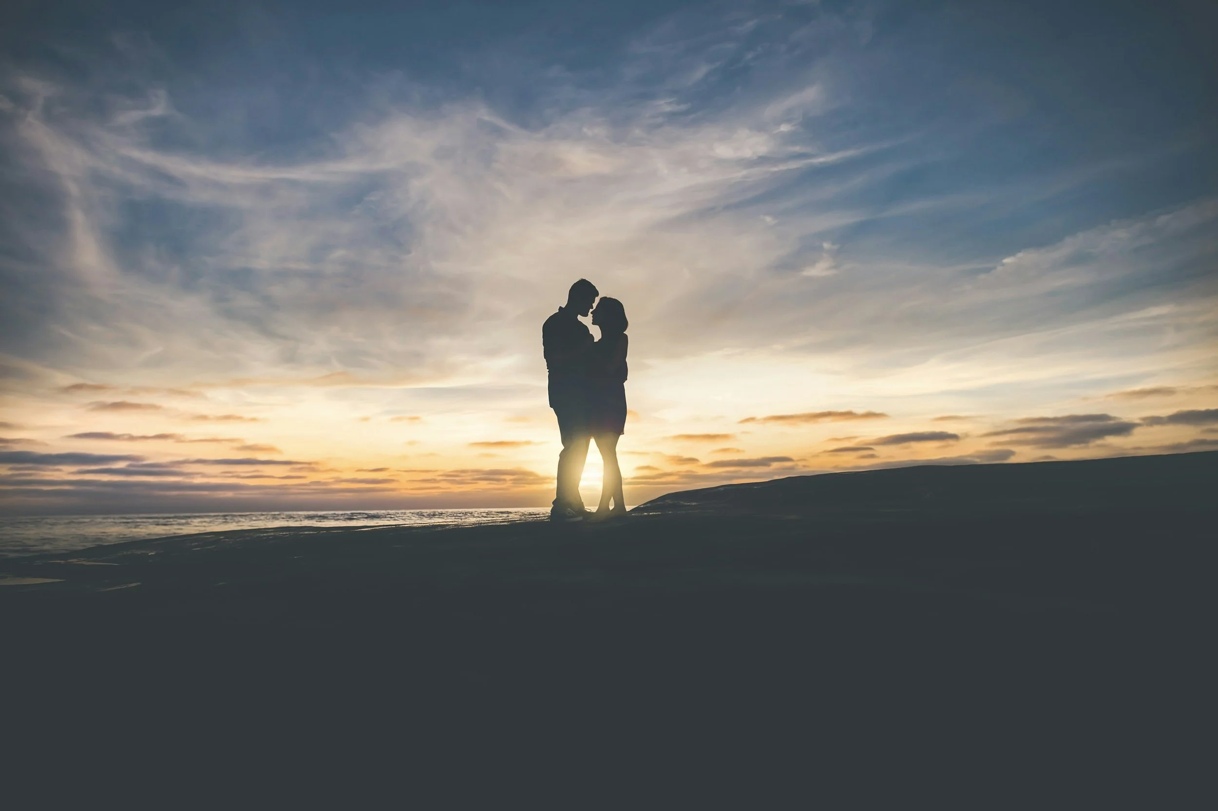 Couple sitting together outdoors